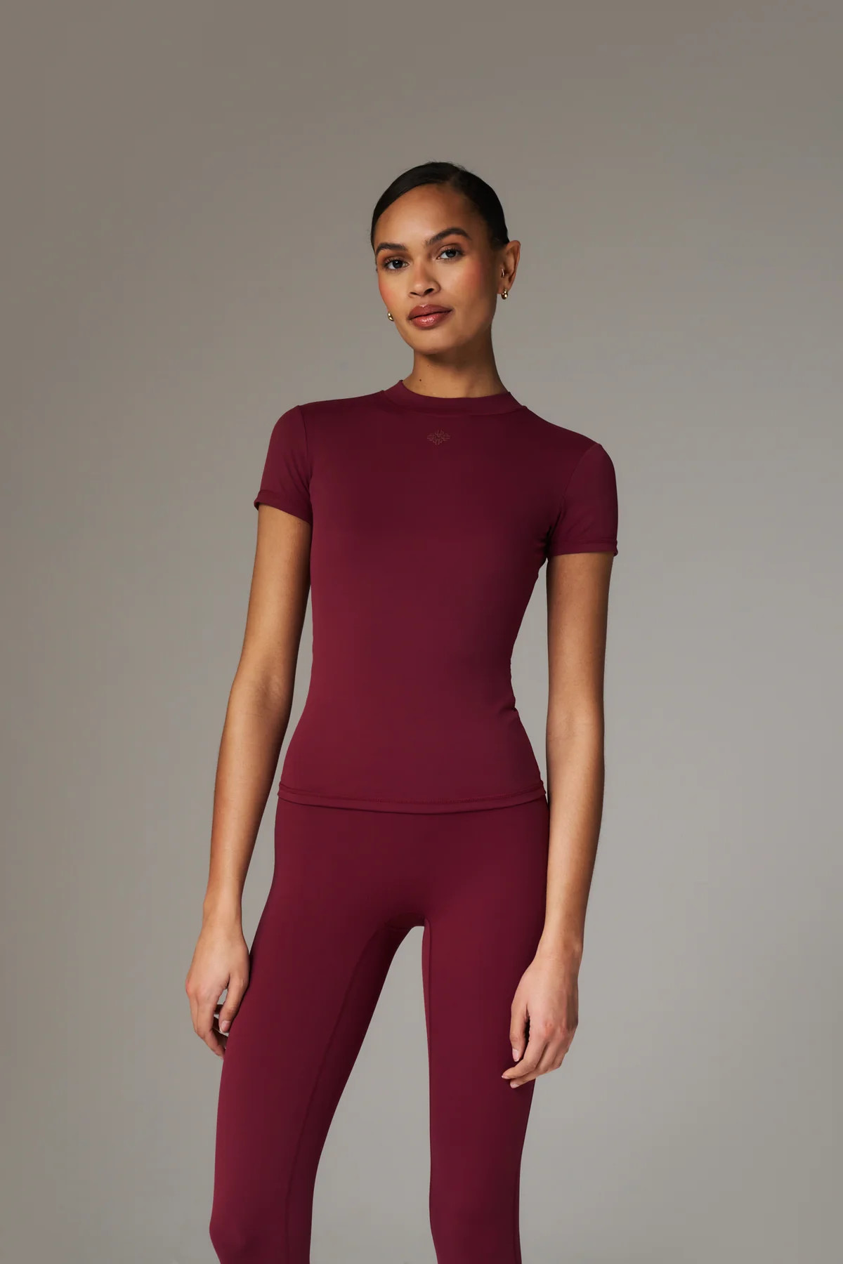 SCULPTING STRETCH EMBLEM BABY TEE - BURGUNDY | The Couture Club