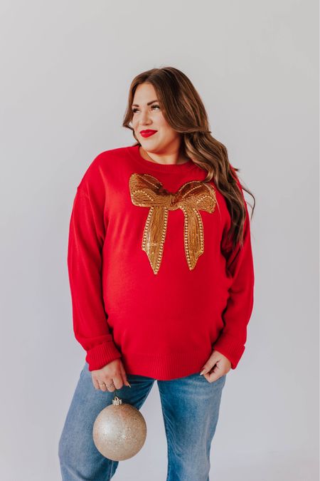 curvy red and gold sequin bow sweater! part of my Merry Pinkmas collection with Pink Desert! i’m in the 2X, typically would take the large not pregnant. runs TTS!  🩷

wearing size 34 in maternity denim. 

#LTKHoliday #LTKfindsunder100 #LTKmidsize