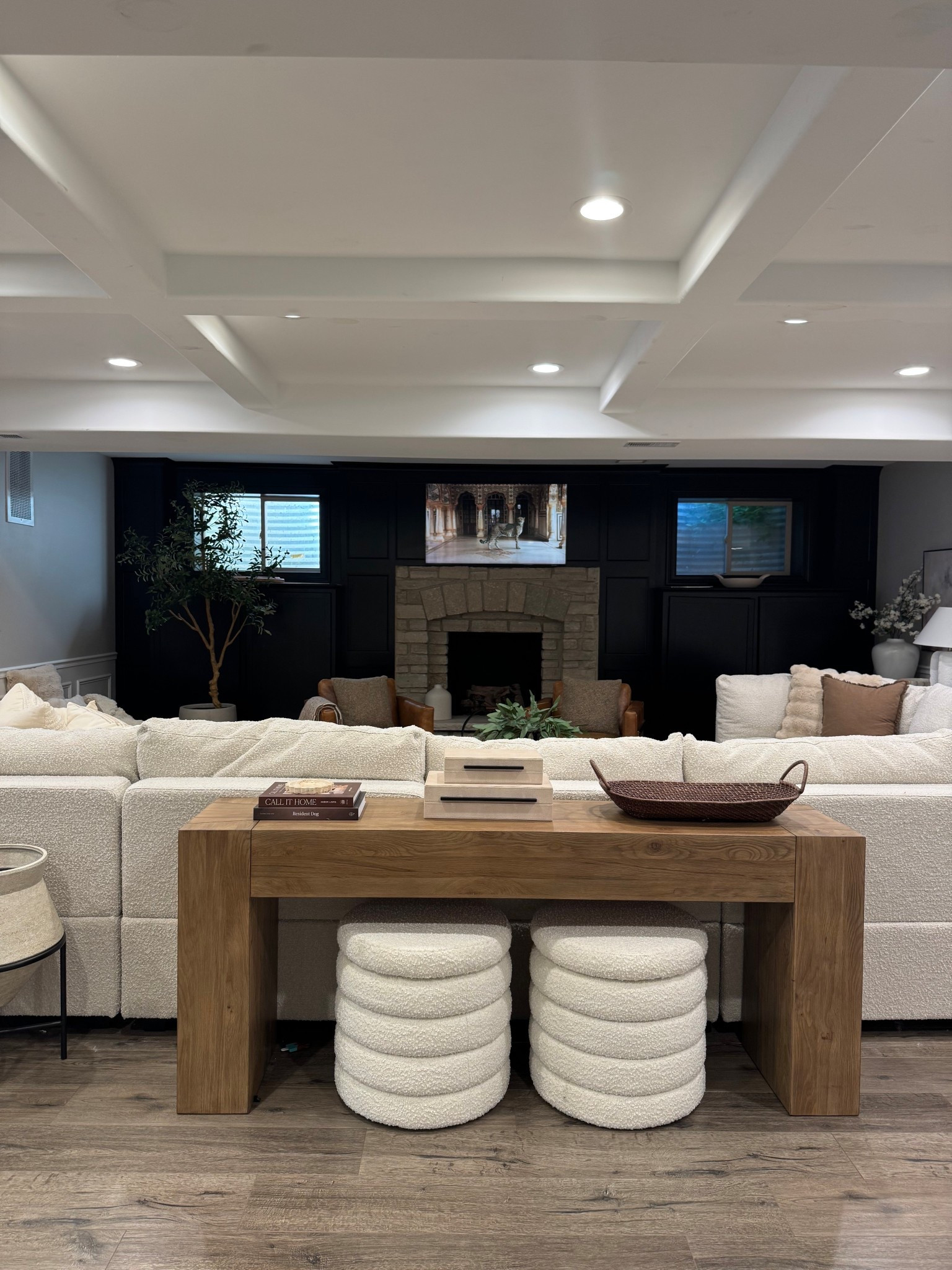 Console table behind sofa styling idea! This table has the perfect wood tone to add warmth to a space and I love these boucle storage ottomans. 

#neutralhome #ottoman #consoletable #storageottoman #homedecor #wayfair #wayfairfinds #jossandmain #amazonhome #consoletabledecor #sofa #sectional #livingroom #basement 

#LTKSeasonal #LTKHome #LTKSaleAlert