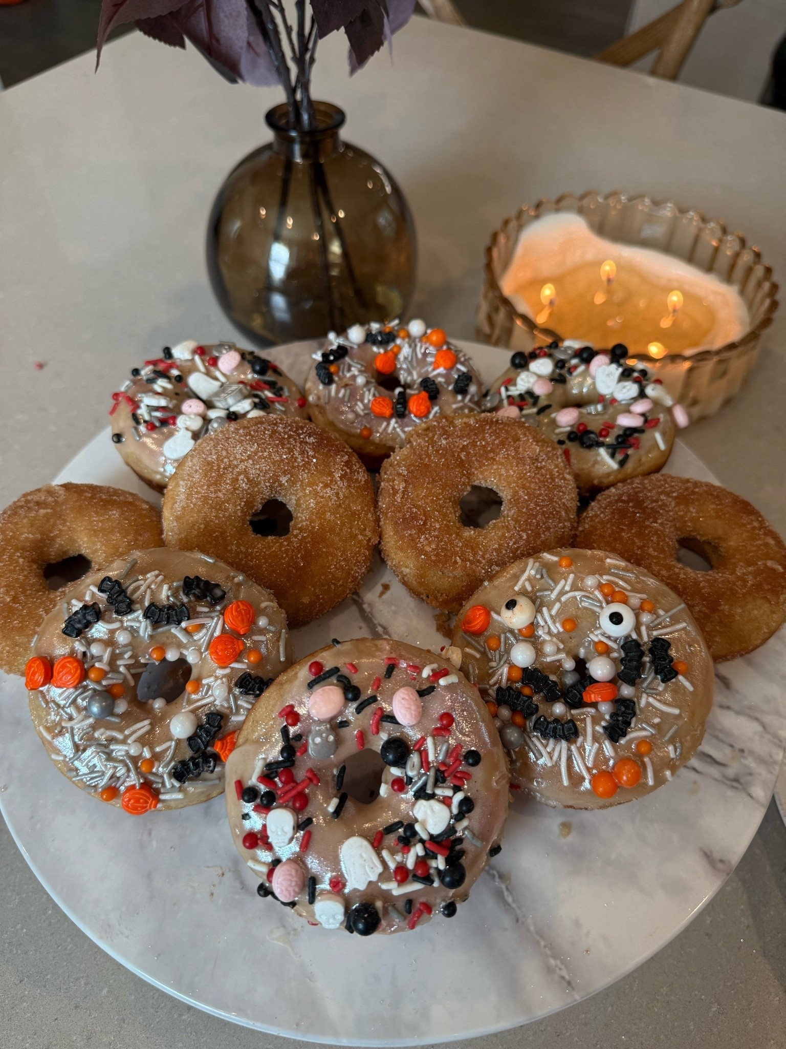 Giving our favorite homemade donut recipe a Halloween twist 🍩🎃 My kiddos love these donuts and I love making them ❤️I make some with cinnamon sugar too which is total fall vibes 🍁 Recipe details are below! 

Donuts
• 1/2 cup of plain Greek yogurt 
• 1/2 cup of milk 
• 1/4 cup of unsalted butter (melted and cooled)
• 1 egg (lightly beaten)
• 1 teaspoon of vanilla extract 
• 1 1/2 cups of all purpose flour 
• 1/3 cup of sugar 
• 1 teaspoon of cinnamon 
• 1 teaspoon of baking powder 
• 1/2 teaspoon of baking soda 
• 1/4 teaspoon of salt 
Glaze 
• 1 cup of powdered sugar 
• 4-5 tsp of milk
• 1/2 tsp of vanilla extract 

(Topping option) 
Cinnamon Sugar Topping 
• 1/4 cup of sugar
• 1/2 teaspoon of cinnamon 
• 2 tablespoons of melted butter 

Preheat the oven to 375 degrees F and grease two 6-cup donut pans with nonstick spray.
Add the yogurt, milk, butter, egg, and vanilla to a medium bowl. Whisk to combine well.
Add the flour, sugar, cinnamon, baking powder, baking soda, and salt to the bowl. Whisk to combine into a thick batter.
Use ¼ cup batter in each prepared donut spot.
Bake for 12-14 minutes, or until puffed up, golden brown, and a cake tester or toothpick inserted into the center of a donut comes out clean.
Remove from oven and let cool for a minute or two. Run a knife around the edges to loosen, as needed, then transfer donuts to a wire rack to cool completely.
In a small bowl mix powdered sugar, milk and vanilla and whisk them together. Dip the tops of the donuts to cover with glaze and then add your sprinkles!

Donuts, Target, Homemade donut recipe, kids snacks, kids breakfast, Halloween party recipes, Halloween donuts, cinnamon sugar donuts

#LTKmomlife #LTKfoodie #LTKSeasonal