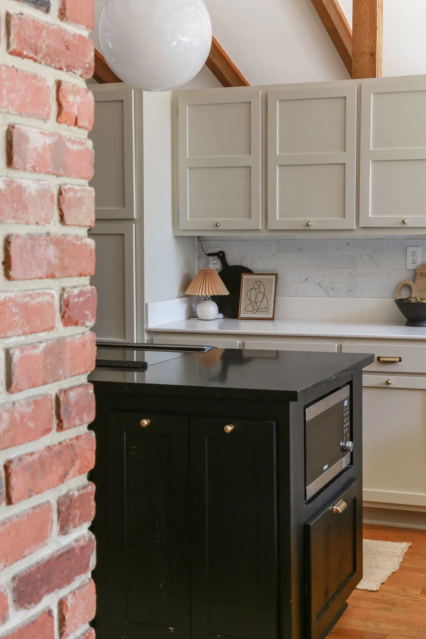 It doesn’t have to cost and arm and a leg to style a kitchen that reflects your unique aesthetic. To shop all my budget-friendly finds, I’ve linked everything up for you! Cabinet paint is Natural Cream by Benjamin Moore and island is Tricorn Black by Sherwin Williams. #kitchen #kitchendecor #cozykitchen #organicmodern #modernfarmhouse #kitchenrugs #kitchenlighting

#LTKFindsUnder50 #LTKHome #LTKFindsUnder100