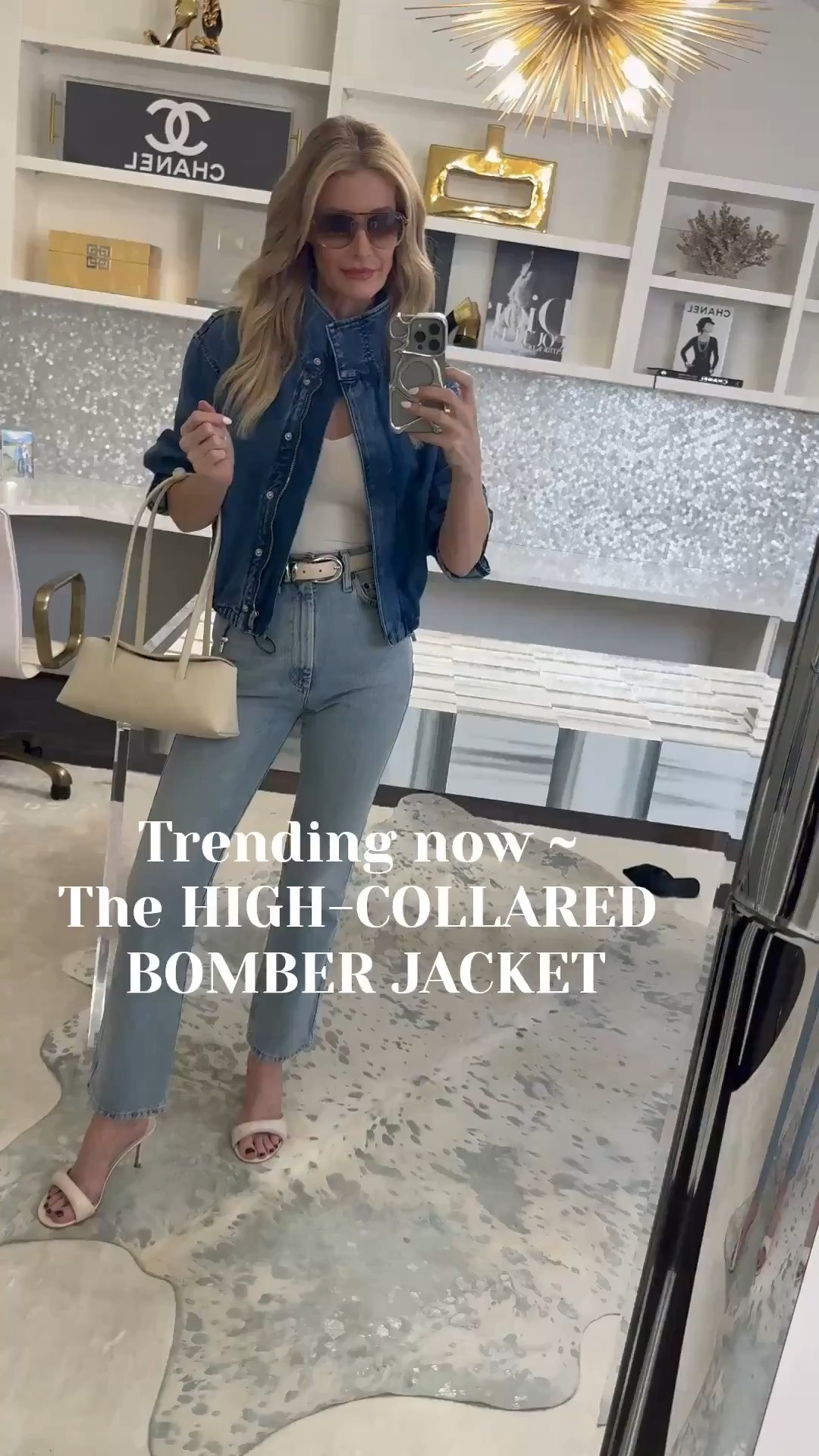 This Madewell high-collared denim bomber jacket is the biggest jacket trend we’re seeing everywhere for 2026 and I totally get the hype. It’s structured, flattering, and instantly makes any outfit look more elevated. Here’s how I took it from wearing to styling: ✔️ Popped the collar + buttoned it at the top ✔️ Pushed up the sleeves (instant cool-girl vibe) ✔️ Tucked in my top + added a belt to define the waist ✔️ Swapped my black heels for ivory heels to create a more cohesive look + make my legs look longer ✔️ Added sunnies ✔️ Grabbed a high-quality handbag for that polished finish These little styling tweaks are honestly guaranteed to elevate any outfit. And if you only add ONE jacket to your closet this season…let it be a high-collared bomber denim jacket. This one is SO good. Sizing: wearing an XS in the jacket + 24 in the jeans.  

 

#LTKdayinmylife #LTKootd #LTKOver40