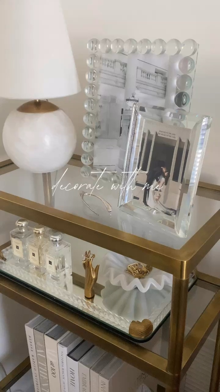 Decorate my Beatrice Etagere from Alice Lane! I love this etagere because of the size and the way it fits so well in my master bedroom! I decorated with neutral coffee table books, Jo Malone perfumes, and crystal frames🤍🤍🤍 

#LTKHome #LTKSaleAlert #LTKFindsUnder100