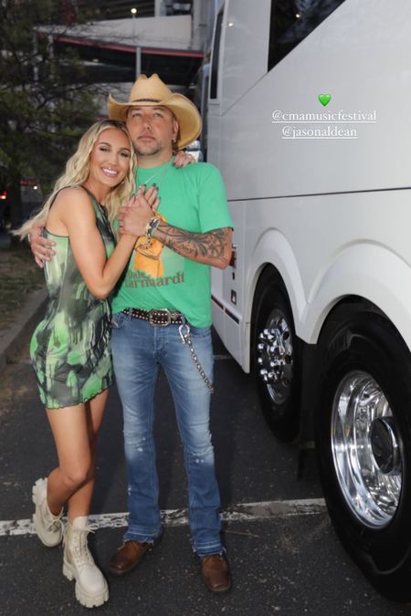Jason and I at CMA Fest 💚 This dress was so comfortable and perfect for this steaming hot night. It’s only $72 on Revolve! 

dress l outfit l cma feat l country concert outfit l green dress l short dress l boots 