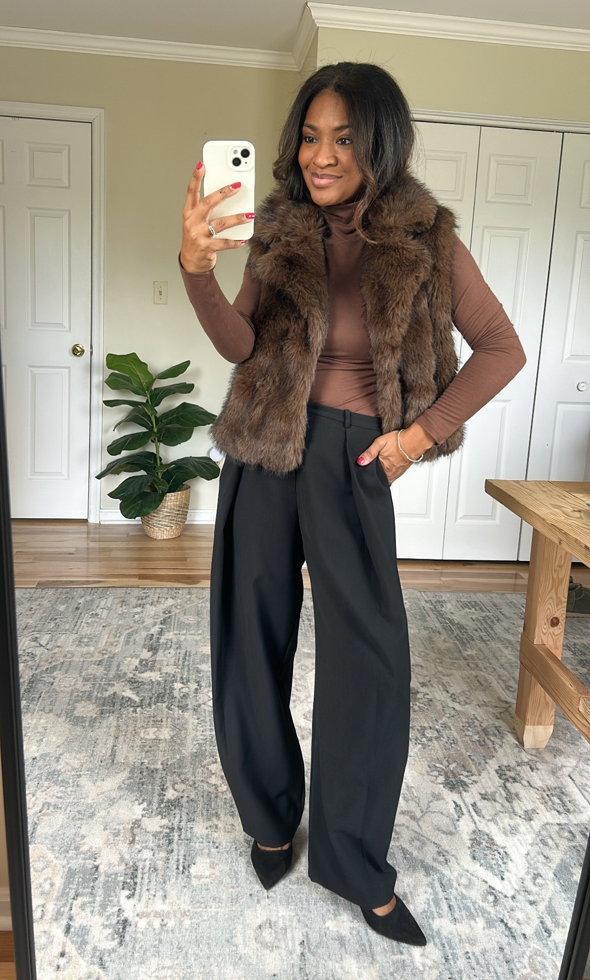 Wearing a s/m in vest. The color is brown. Pants are from Zara, size small/4
