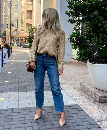 Tan beaded button down oversized blouse from Anthropologie and Everlane straight leg mid wash denim with pointed nude sling backs  

#LTKstyletip #LTKSeasonal #LTKCon