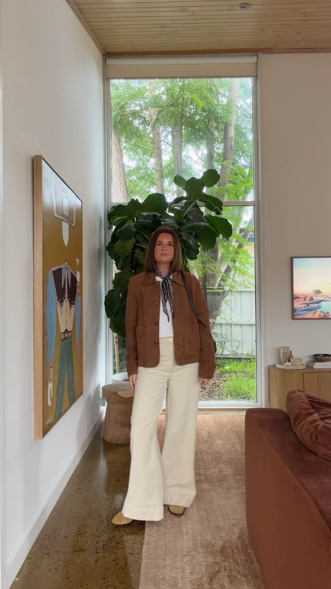 Wearing a size medium jacket, size 12 jeans and size small tshirt
