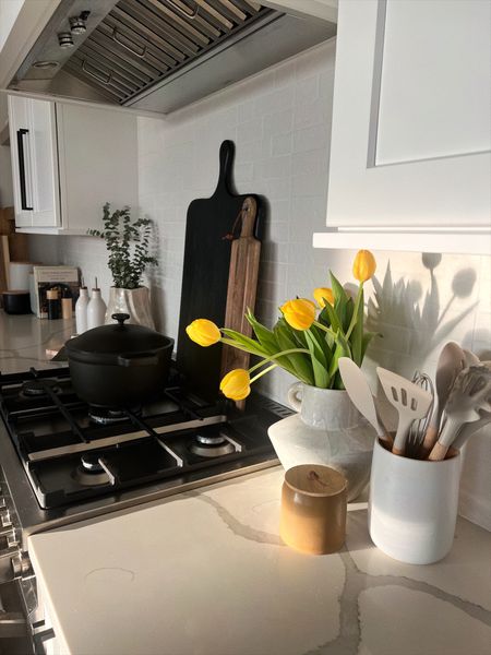 Added a little bit of warmth to our kitchen for spring! Loved layering these cutting/cheese boards. 

Kitchen decor 
Kitchen styling 
 Kitchen counter 

#LTKhome