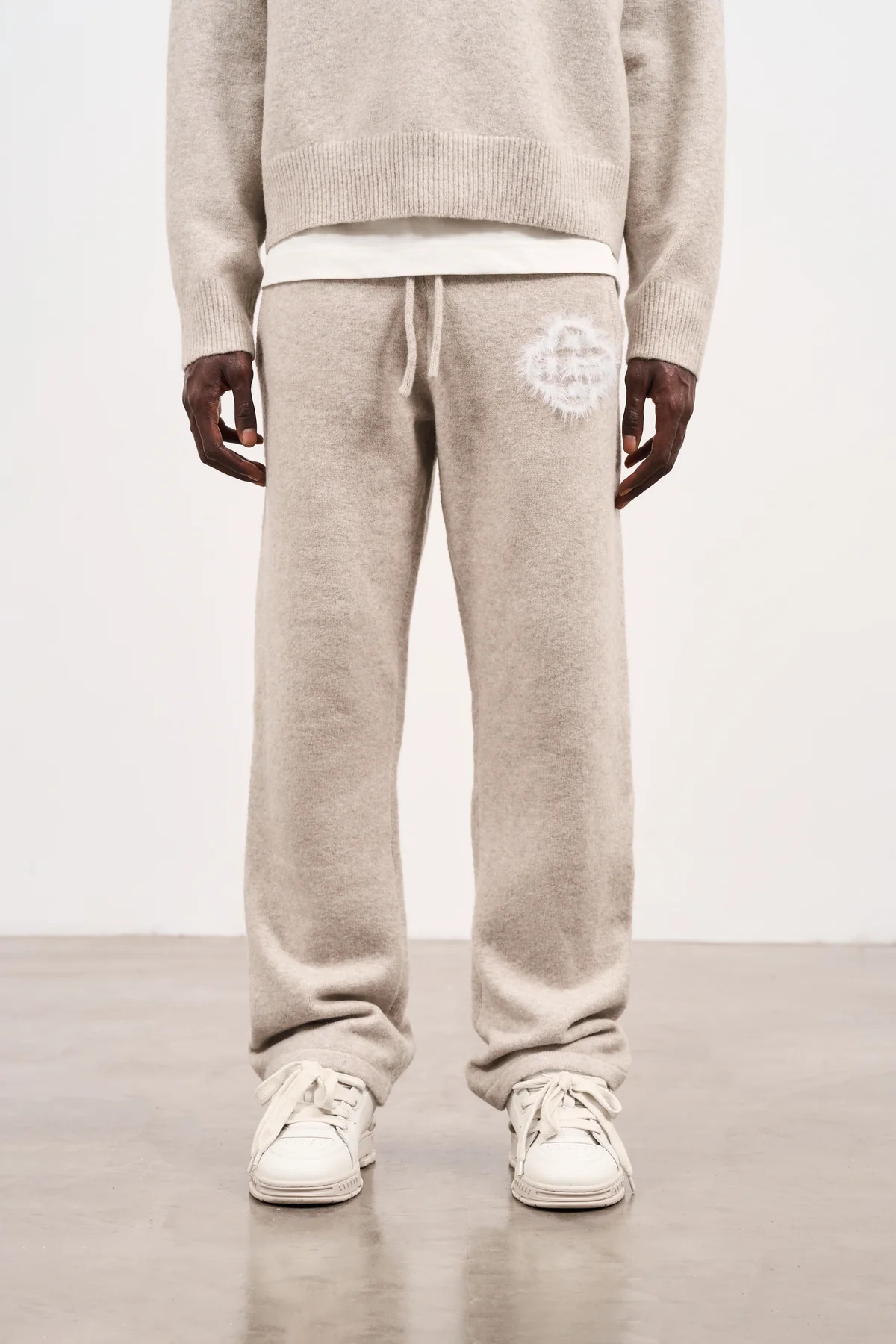 FLUFFY EMBLEM KNITTED JOGGERS - BEIGE | The Couture Club