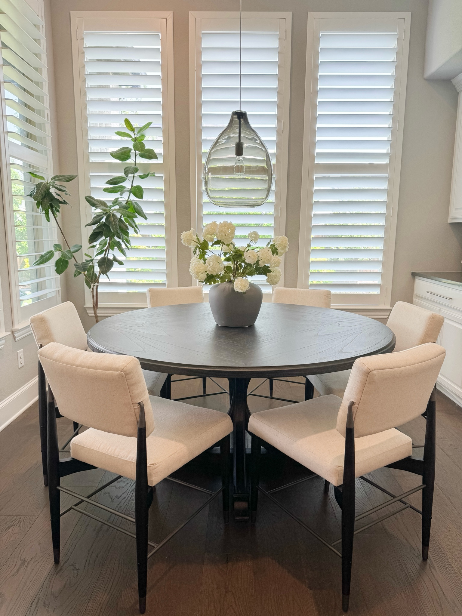 Transitional kitchen table and chairs, white performance fabric chairs, afloral summer flowers, black French country table, Kathy Kuo 

#LTKSummerSales #LTKHome #LTKSeasonal