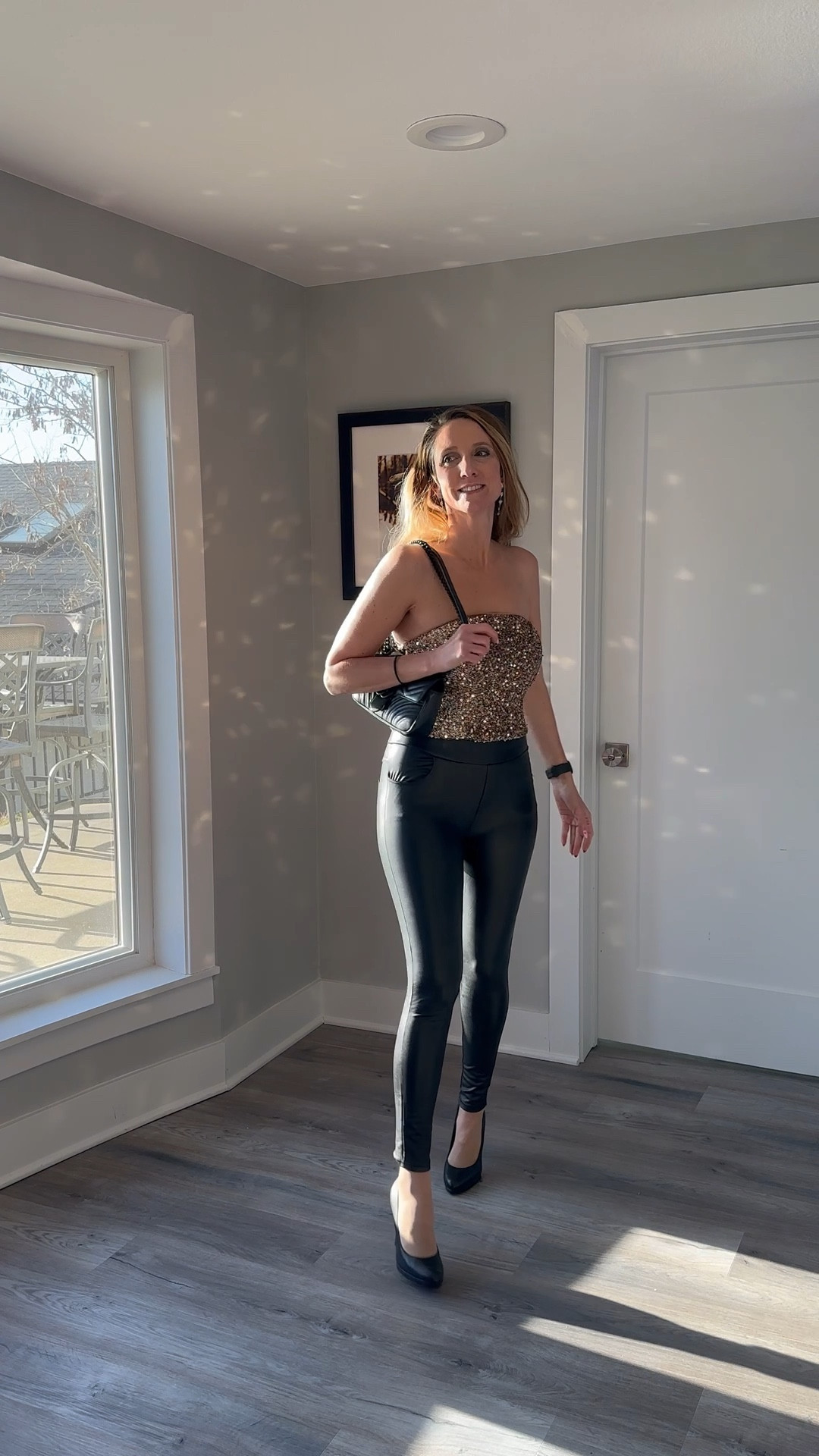 Golden hour hits a little differently when you’re literally wearing the sparkle. 🎀✨ A strapless sequin top and classic black stilettos are a timeless duo that always feels high-fashion. Check out the link in my bio to shop this exact outfit before your next event! 🌟 #StyleInspo #GoldSequins #OOTD #ShopMyLook

My Sequin Sparkle Style Breakdown
• The Top: I’m wearing a gold-toned, strapless sequin tube top that catches the light perfectly, providing a structured yet shimmering focal point.
• The Bottoms: I’ve paired the sparkle with high-waisted black faux leather leggings that create a sleek, streamlined silhouette.
• The Footwear: I finished the look with classic black pointed-toe stiletto pumps to elongate the leg and maintain the sophisticated vibe.
• The Accessories: I’m carrying a black quilted leather crossbody bag with a gold chain strap and signature hardware that ties the gold and black elements together.
• The Vibe: This is the quintessential evening look—glamorous, bold, and perfect for any occasion where you want to shine without trying too hard.

Gold sequin top, strapless shimmer blouse, black faux leather leggings, leather-look pants, black stiletto pumps, quilted crossbody bag, gold chain handbag, evening party outfit, date night style, glam fashion, holiday party look, LTKstyle @VICI 

#LTKgrwm #LTKSeasonal #LTKootd