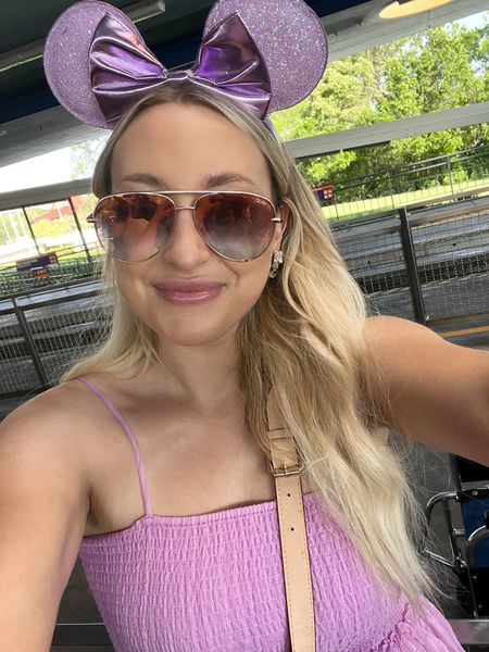 Matched my outfit to my favorite bathroom because, duh. 

A few of my Disney park outfit hacks:

✨ Always bring a fanny pack - Pack your family’s stuff in a bag/backpack to put under the stroller, but use a fanny pack to easily access items like your phone and sunglasses as you are getting on and off attractions 

✨ Wear shorts under dresses - Dresses are a great warm weather option, but I always wear lightweight bike shorts underneath. This helps with thigh rub and makes it easier to run around with the kids without worrying. 

✨ Comfy shoes - This one seems obvious, but it took me a while to find the *perfect* Disney park shoe. The Nizza platform from adidas are my go to. They are incredibly comfortable but still cute and can pair well with shorts or dresses. 