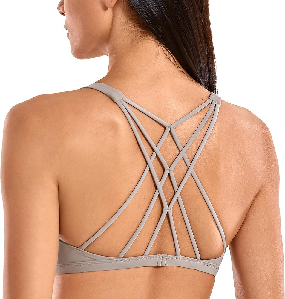 CRZ YOGA Women's Cute Yoga Sports Bra Strappy Sexy Criss Cross Back Padded Low Impact Workout Bra... | Amazon (US)