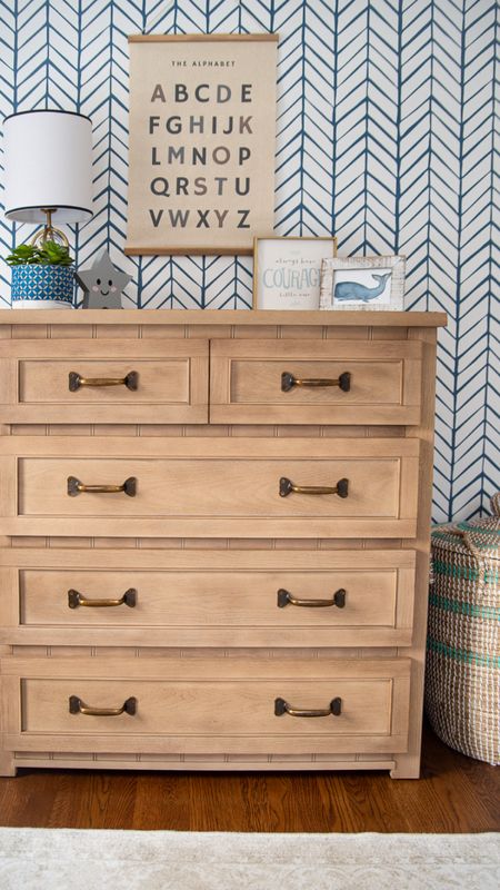 Little boys coastal style bedroom with wood dresser, pattern wallpaper, Seagrass storage basket, and more kid bedroom home decor 

#LTKfamily #LTKhome #LTKkids