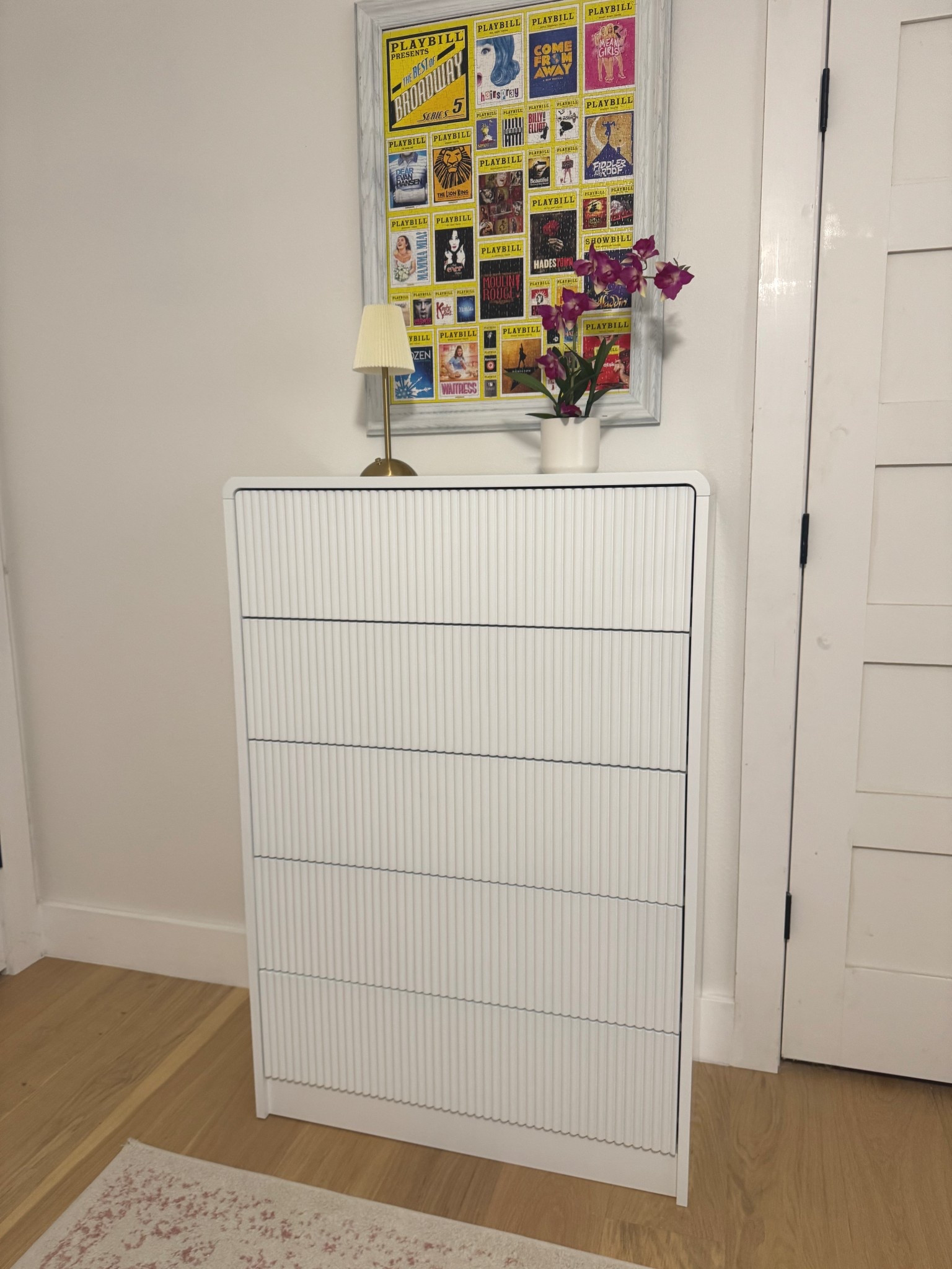 White rubbed front dresser with no pulls. What? No pulls? Yep, just gently push on the drawers and they open. Keeps a clean lined look for a chest of drawers. Looks high end and very stylish. Comes in multiple colors. Would be perfect for a nursery too.

#LTKHome #LTKKids