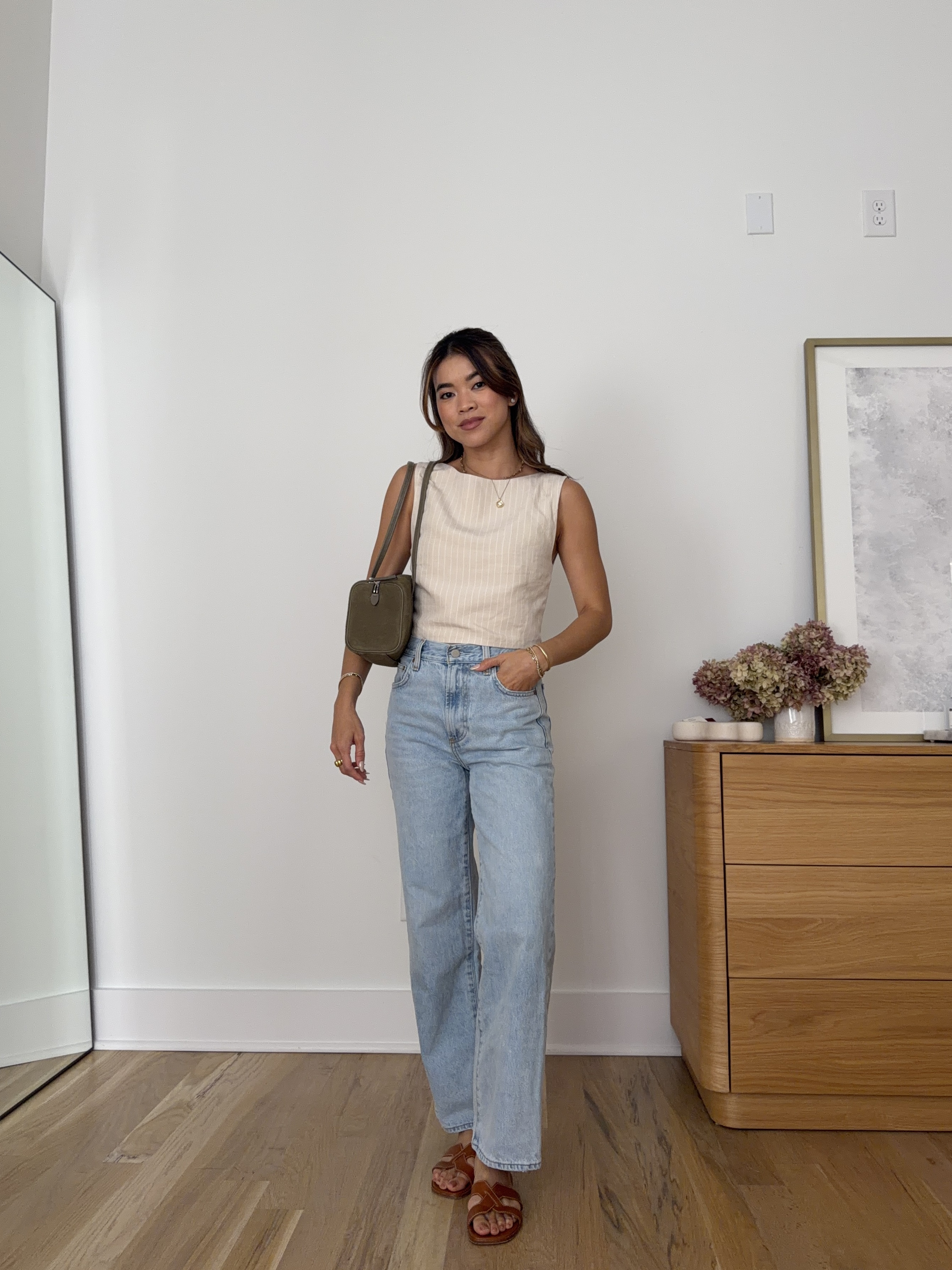 Wearing my favorite denim from @Aritzia! These fit me perfectly (I’m 5’2).

Sizing info:
- Aritzia Cavalier Top (TTS or size up, runs snug, Size 2XS in Byrd Strp Ntrl Ecr/ok)
- Aritzia Denim Forum The Farrah Hi-Rise Wide Ankle Jean (Size 24 in Vintage Light Blue)
- Margaux the MX sandal (In Saddle Calf)

Petite style, petite fashion, mom outfit, mom style, petite pants, petite outfit ideas, petite outfits, best pants for petite, petite denim, spring style, spring outfits, beach outfits, vacation outfits, summer outfits, Summer style, summer trends, aritzia denim

#LTKootd #LTKSeasonal #LTKPetite