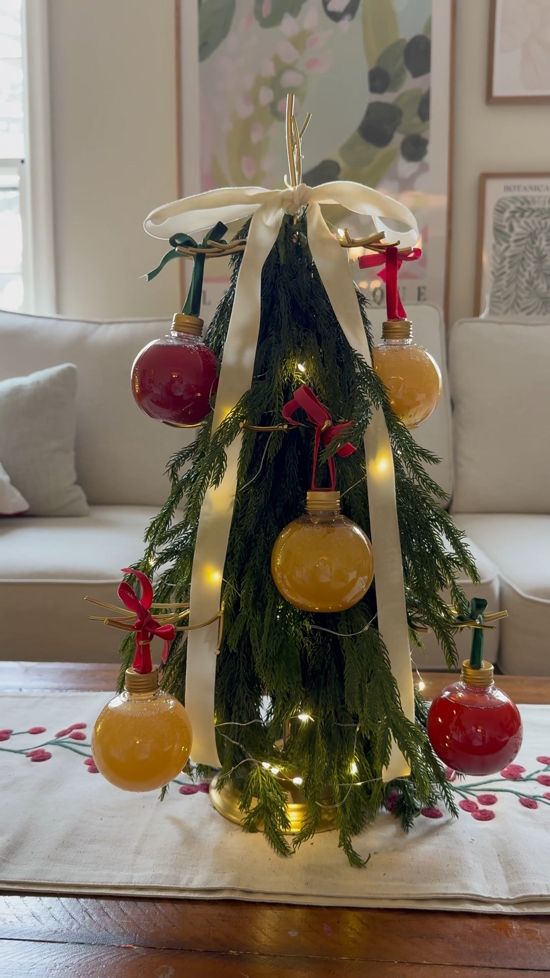 This ornament cocktail tree is perfect for holiday entertaining! I added these greens to turn it into a festive Christmas tree and you can fill these ornament balls with any cocktail or mocktail you choose!

#LTKSeasonal #LTKHome