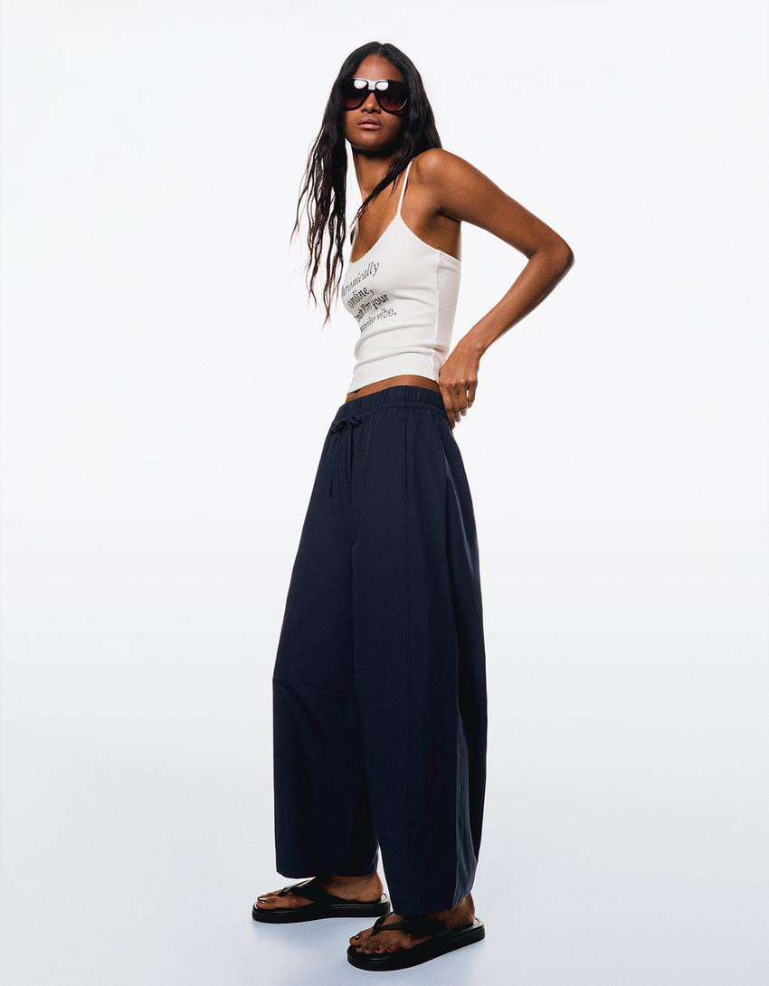 Low-rise boot-cut trousers - Trousers - Women | Bershka GB