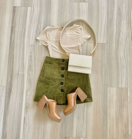 A #fall #flatlay brought to you by #amazon and #target 🍂🛍️

#skirt #cloggs #beige #green #bodysuit

#LTKfindsunder100 #LTKSeasonal #LTKfindsunder50