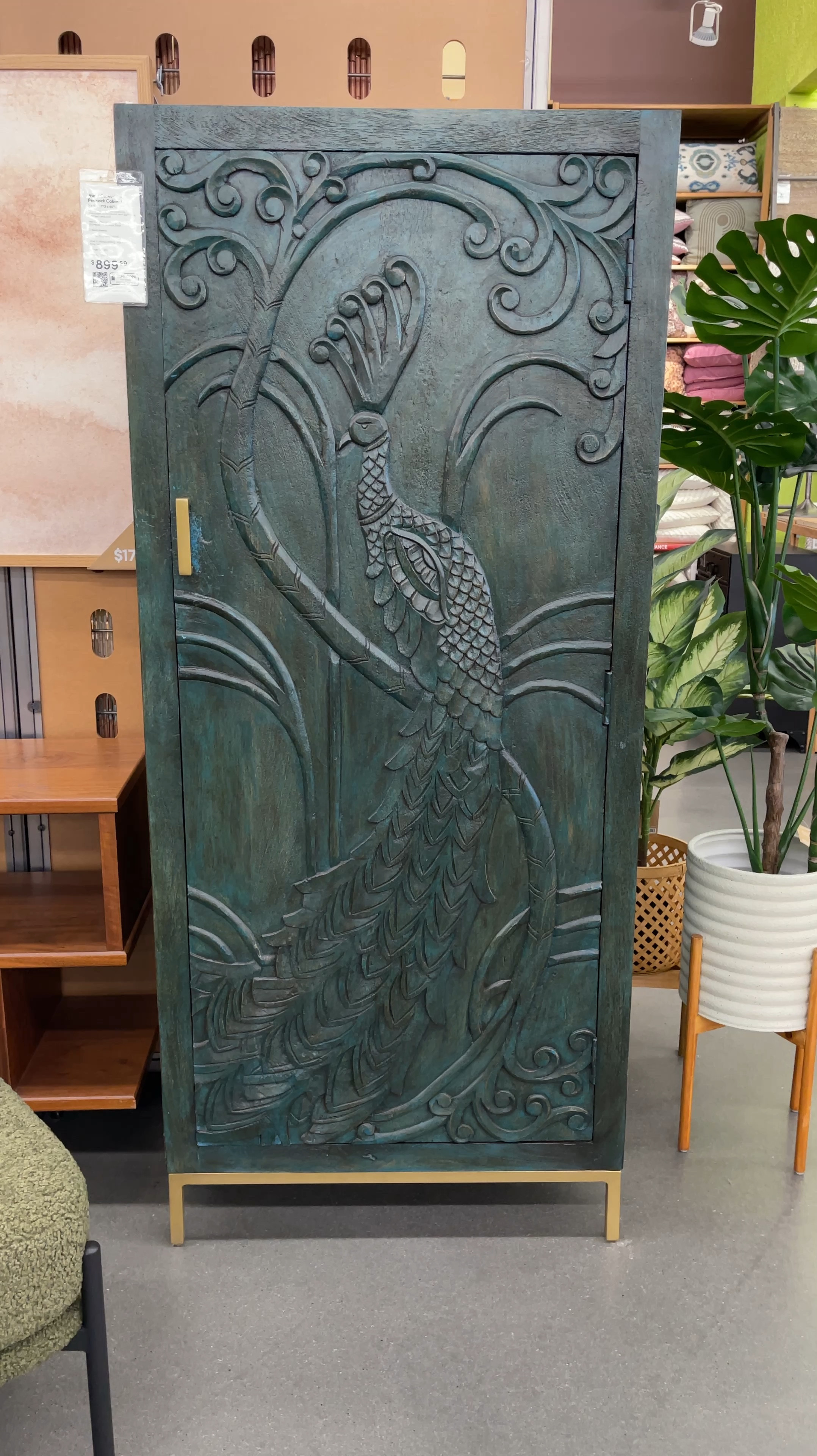 Turn heads with this bold peacock cabinet! 🦚 Hand-carved mango wood with distressed teal and turquoise accents makes a stunning statement, while the gold-metal stand adds a modern touch. With two spacious shelves, it’s as practical as it is artful. Perfect for bringing personality and heirloom-quality style to any room. 💚Linked more unique storage pieces for your space! ✨

#LTKWatchNow #LTKSaleAlert #LTKHome