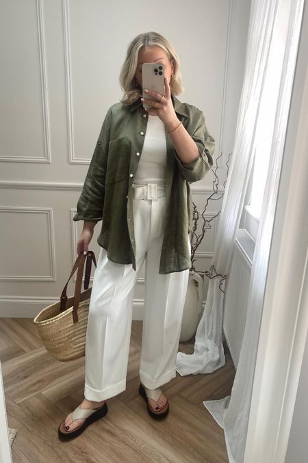 Spring summer outfit - khaki green linen shirt, Uniqlo bra vest top, marks and Spencer white belted smart trousers, fitflop sandals & Loewe basket bag  

#LTKSeasonal #LTKeurope #LTKstyletip