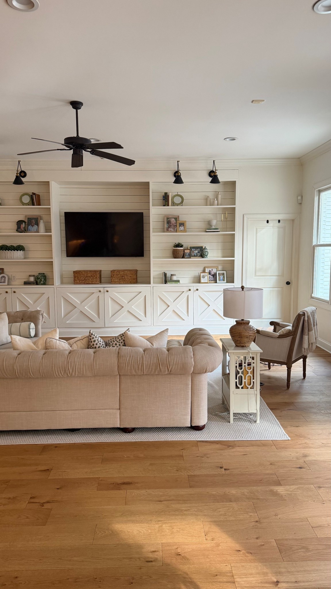 Our family room as the spring morning sun begins to slip indoors, a favorite time of day for me! Linking some of my built in decor, lighting, rug and pillows! ☀️

#LTKHome