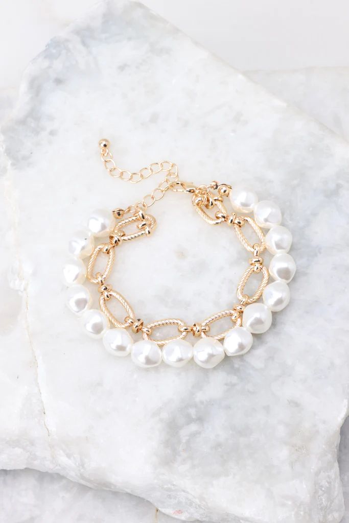 Pulling Heart Strings Gold Pearl Bracelet | Red Dress 