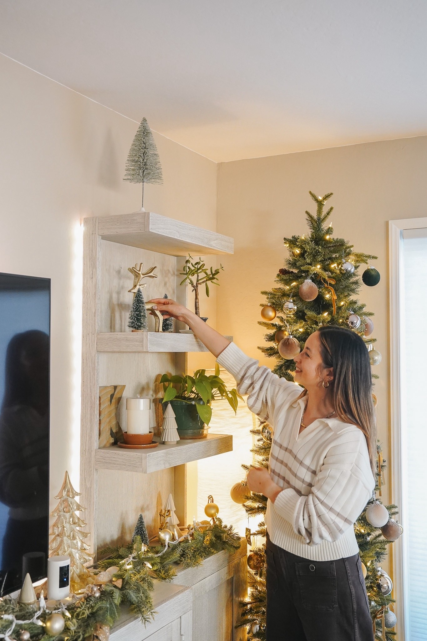 #ad The holidays always bring out my love for cozy spaces, the soft glow of the tree, rich textures, and those little festive touches that make home feel extra warm. This year, I added a few new pieces that completely transformed our living room: rich pillows, garland draped across the mantel, fresh stockings, and the softest twinkle from our GE Cync smart lights.
I love that I can control everything right from my phone, from the lamps to the light strips and even the Christmas tree — all with just a tap. It makes decorating simple, beautiful, and so much more fun with the kids around. Sharing everything I used to create this cozy holiday look, all linked on LTK. 🎄✨

#LifeinCync #gelighting #TargetPartner @gelighting @target @shop.ltk #liketkit #target 

#LTKFamily #LTKHome #LTKHoliday