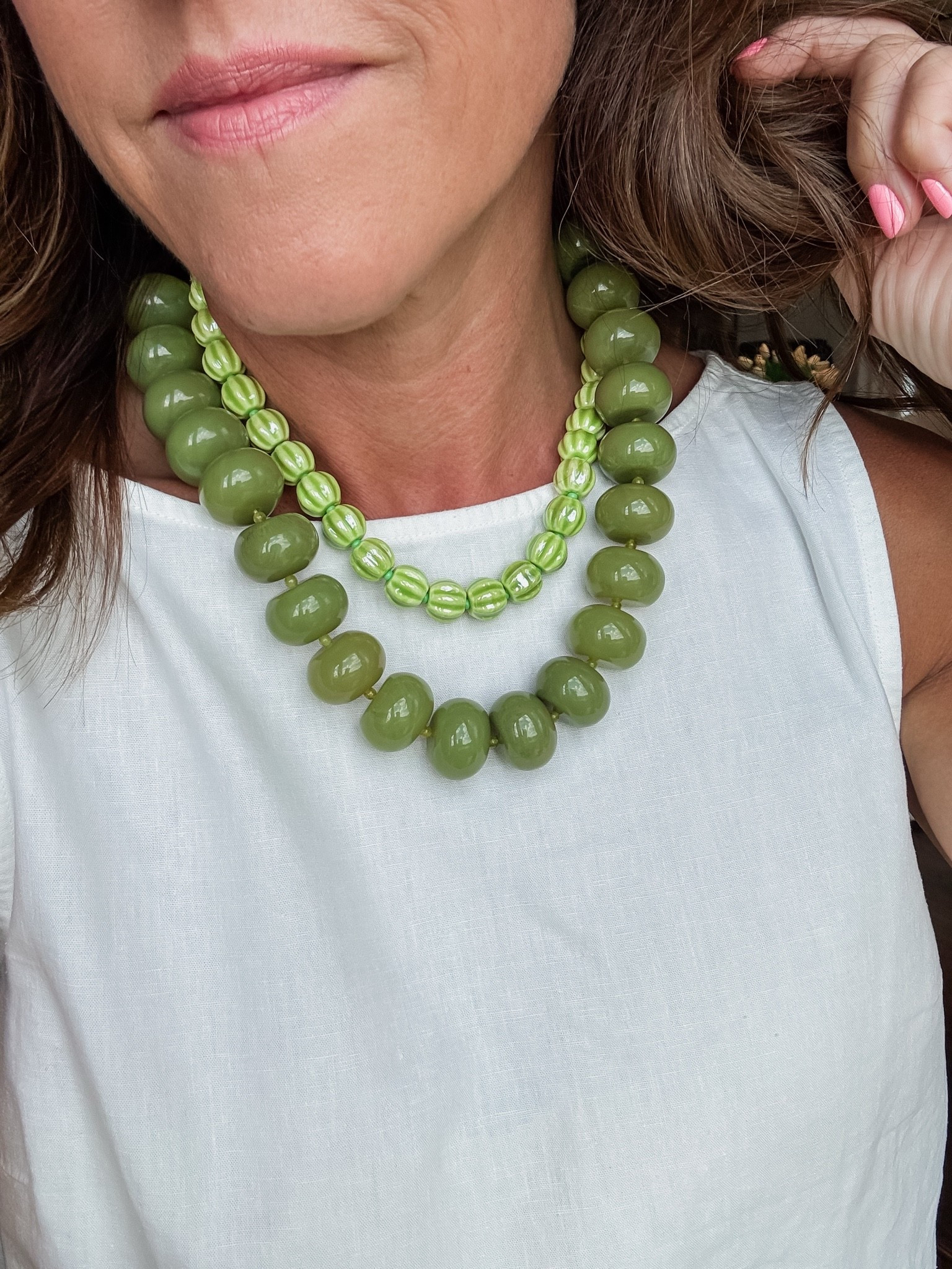A fun layered combo. 
Big necklace color: Olive
Smaller necklace / 20% off code: twopeasinablog20
XS tank

#LTKootd #LTKmomlife #LTKOver40
