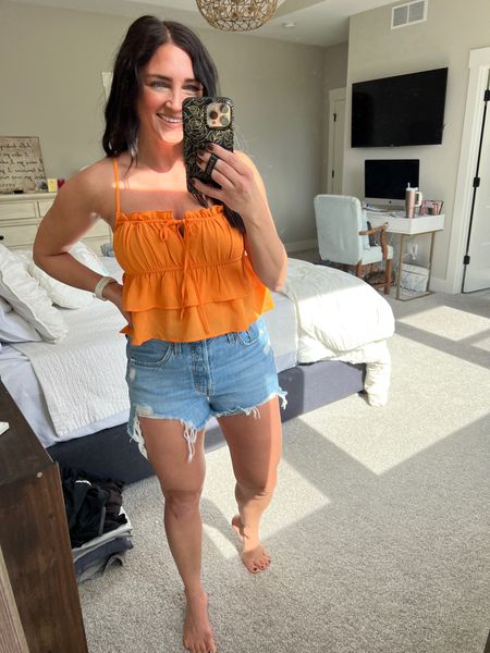 Fun flowy orange tank that’s perfect for spring break! TTS. Wearing a small. The best denim shorts. Size up 1. 

#LTKFind #LTKunder50