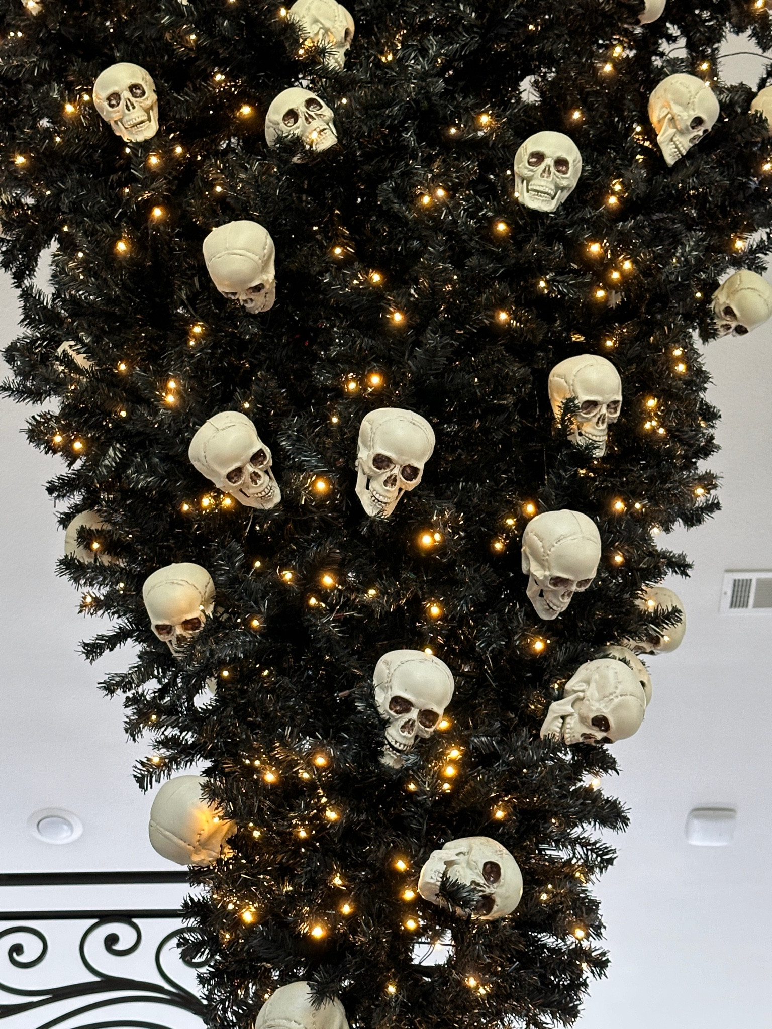 Black Halloween tree with skulls 

#LTKHome #LTKSeasonal
