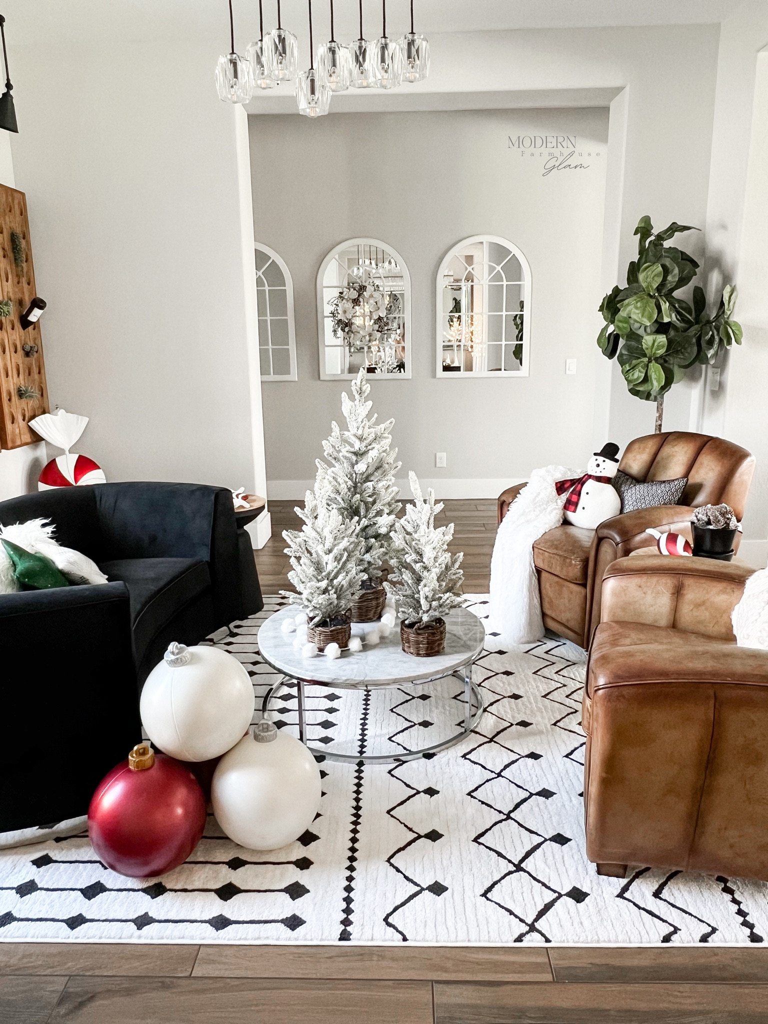 Barrel Room at Modern Farmhouse Glam 
Large, oversize ball, ornaments, Christmas, decorations, leather chair, black, velvet, loveseat, table top, flocked Christmas trees in baskets, marble coffee table, mirrors, wooden wine, bottle holder, sofa, living room  wine room peppermint candy decor 

#LTKsalealert #LTKSeasonal #LTKhome