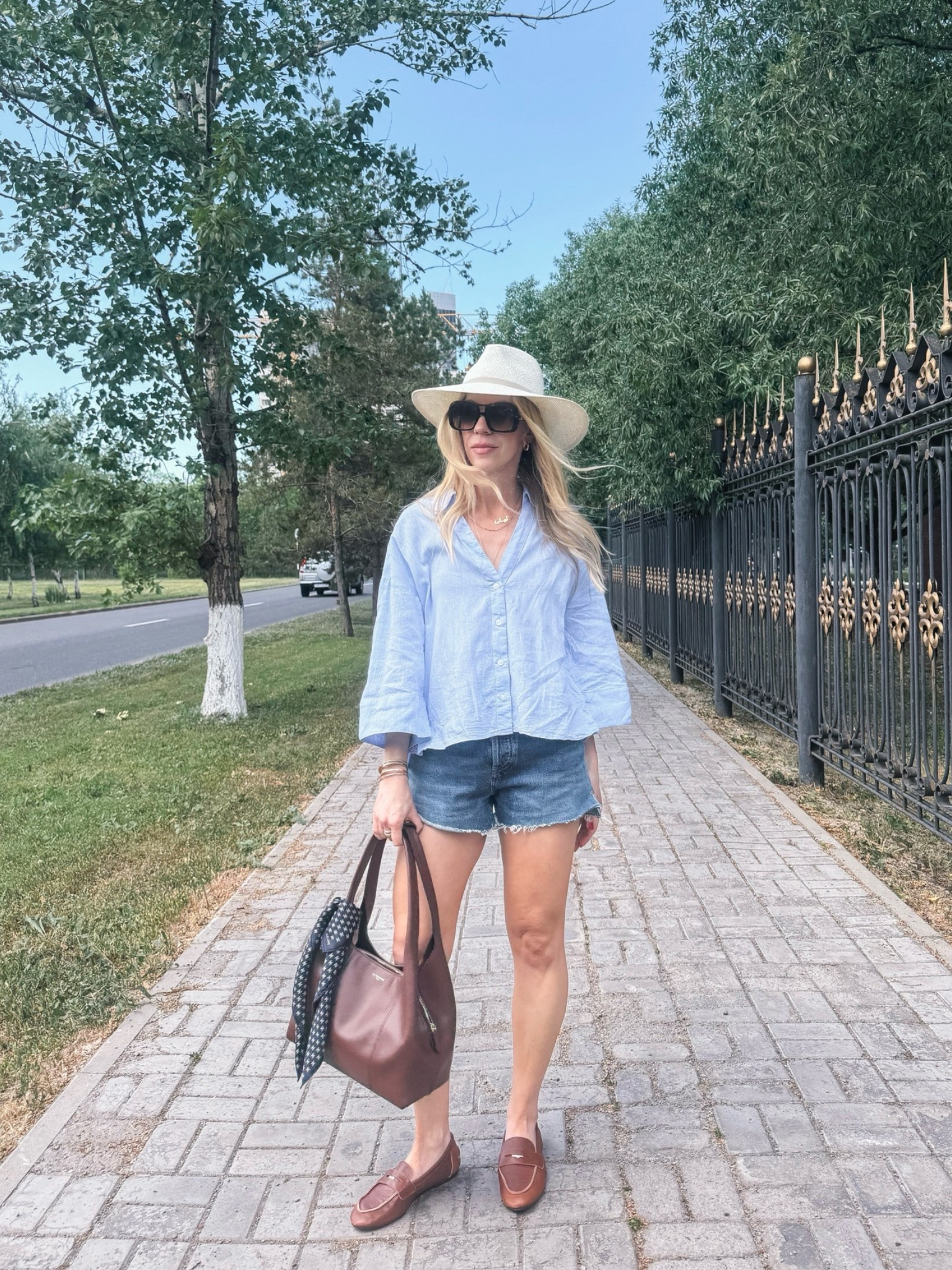 Casual summer outfit with @Janessa Leone straw hat, oversized linen shirt, cutoff denim shorts, @Zara leather loafers (on sale now)

#LTKSaleAlert #LTKSeasonal #LTKOver40