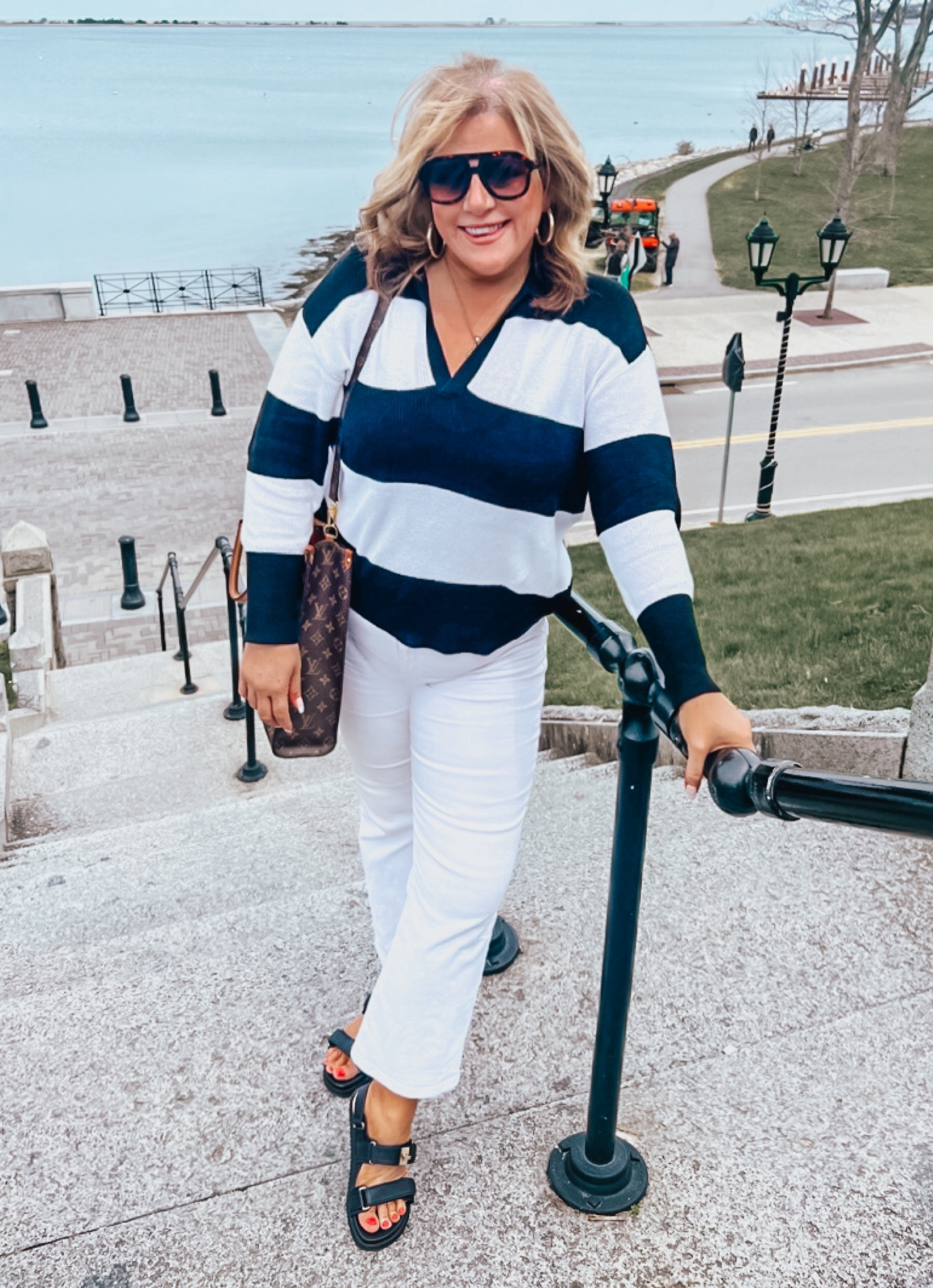 Absolutely LOVING this whole outfit! This is the ideal spring weight sweater. It could also look perfect thrown on with a pair or cutoffs of crisp linen shorts. It’s so versatile! 
It’s still SO chilly here in New England, so I’m wearing it with with jeans and dad sandals.
Jeans, spring outfits, stripes, sandals, casual outfits, weekend outfits.

#LTKfindsunder100 #LTKSeasonal #LTKfindsunder50