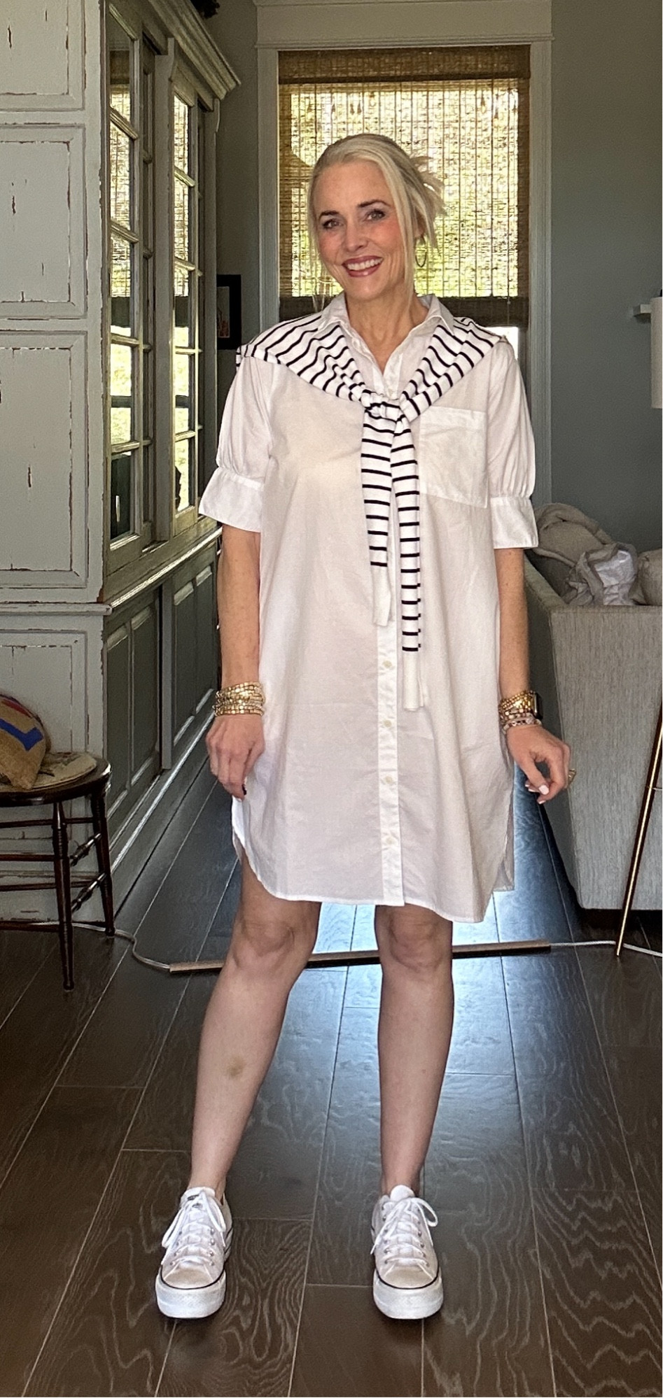 And here she is in white. Crisp, clean, and classic. Styling it today with this faux sweater in navy and white stripes (it’s not a real sweater) and platform Converse. 

I wore this dress in either black, white or blue on REPEAT all last year. I wanted this denim one but it was sold out. I’m telling you now to GET IT BEFORE it sells out. You will thank me later. Promise. 

I’m in a medium in the regular length but could’ve done a small. It comes XS-4XL and in regular, petite, and tall. Sizes are selling out quickly though. 

As a reminder for reference, I am 53, 5’8, 140ish lbs, and typically wear a 6/8/M  

#LTKSeasonal #LTKover40 #LTKmidsize