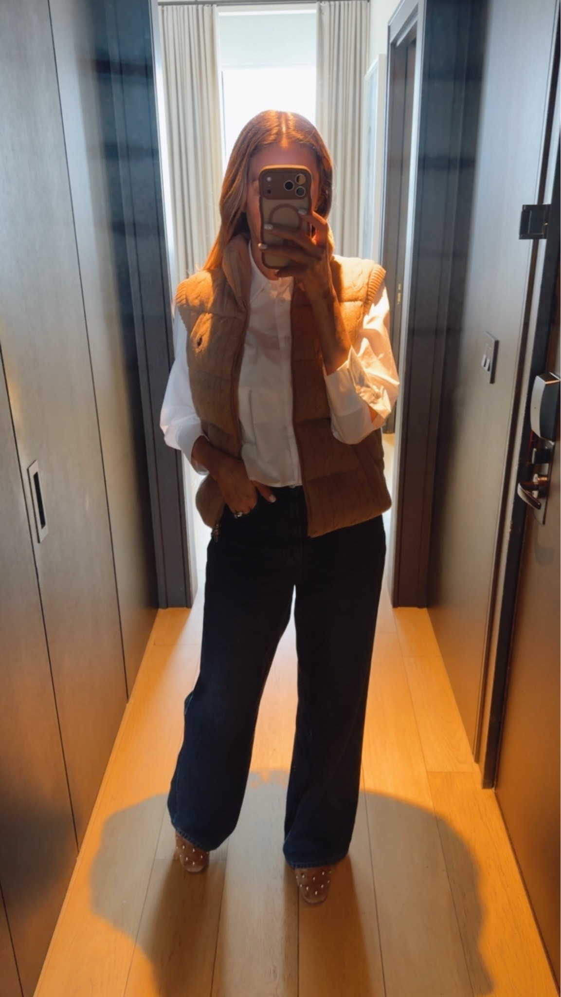Fall outfit idea I wore in New York 
Vest, white button down, jeans and studded flats. Everything runs true to size I’m wearing size small.

#LTKU #LTKootd #LTKSeasonal