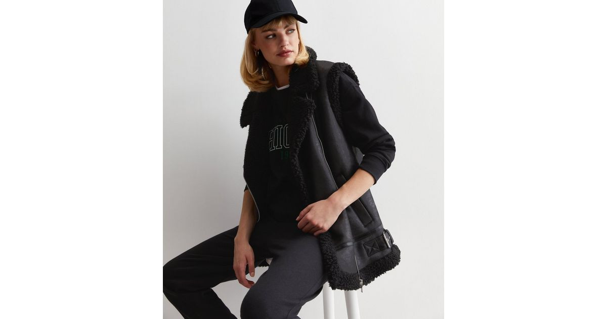 Black Leather-Look Faux Shearling Lined Aviator Gilet
						
						Add to Saved Items
						Remov... | New Look (UK)