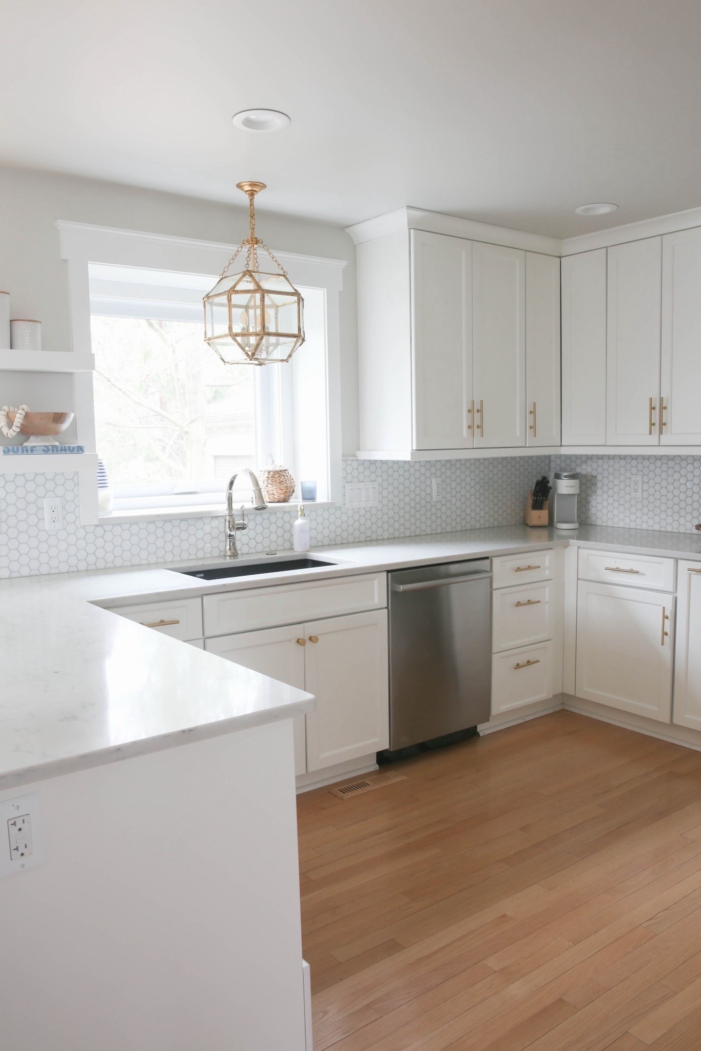 This white coastal kitchen is light, bright and airy! The brass pendant light adds the perfect touch to the whole space! 



#LTKHome #LTKSaleAlert #LTKU