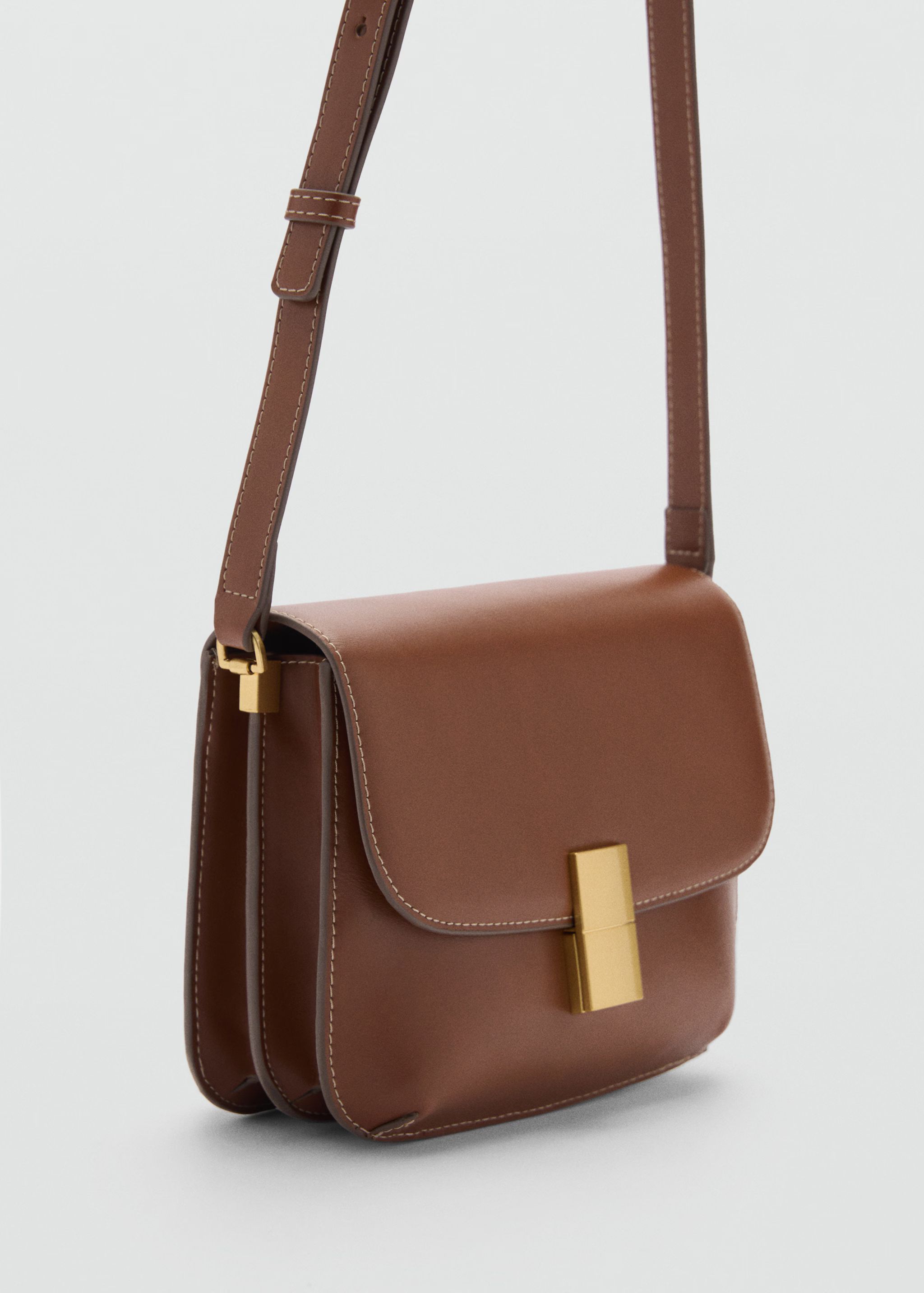 Crossbody bag with metal closure - Woman | MANGO USA | MANGO (US)