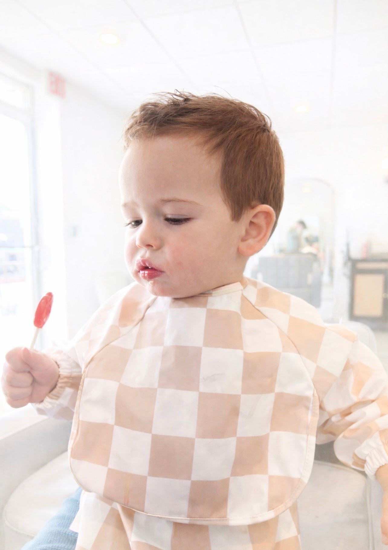 And obviously give them a sucker for distraction lol works every time our favorite bib is from  @callaandfriends #toddler #momhack #momlife #toddlerhair #toddlerhairstyles 