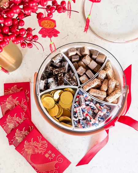 Lunar New Year Snack Tray and Vase! 

Divided serving tray with lid and handle, milk chocolate coins, Loacker Chocolate wafers, almond roca, white rabbit creamy candy, artificial plants, hanging pendants, brass vase

#LTKhome #LTKSeasonal #LTKMostLoved