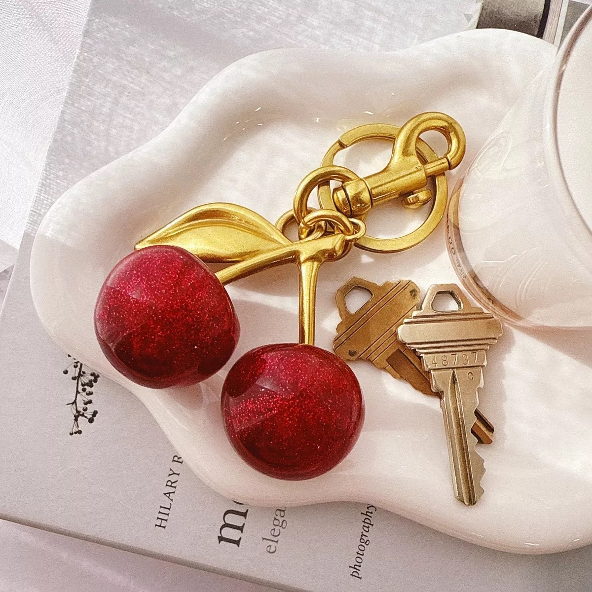 Glittery Shimmer Cherry Bag Charm 



Keychain | Purse and Handbag Accessory | cherry accessory | bag charm | Mother’s Day | gift idea | Bruno Mars tees | concert outfit | clear stadium bags 


#LTKootd #LTKMothersDay #LTKFestival