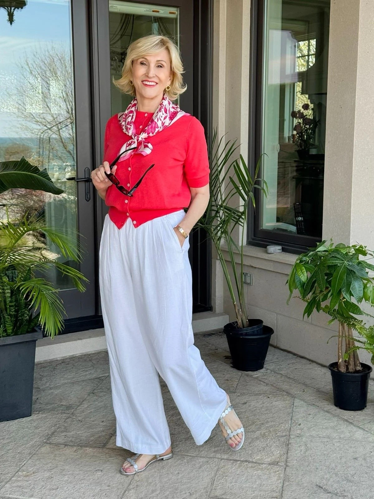 A lightweight cardigan is one of my favorite ways to add a little extra arm coverage without sacrificing comfort or style. ❤️ This short-sleeve red sweater cardigan is the perfect layer for those days when you want to feel just a little more covered while still staying cool.
Paired with crisp white linen pants and silver sandals, it’s an effortless look that’s polished, comfortable, and perfect for everything from lunch with friends to a day of shopping.

#LTKSeasonal #LTKOver40 #LTKootd