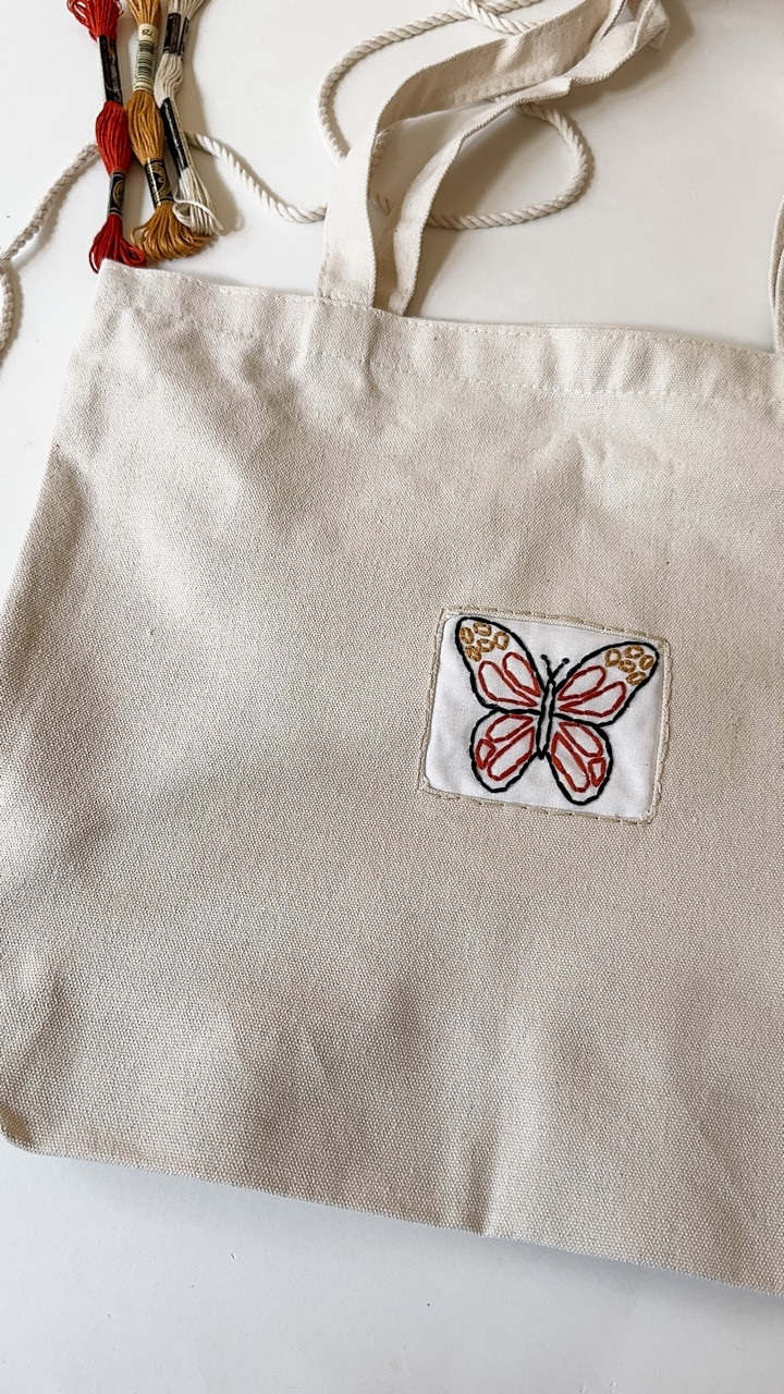 Wanted to repurpose this embroidered butterfly and I thought it would be so cute on a bag! 

This butterfly actually came from a kiddie kit in my shop and now I’m thinking I need to have my son embroider the Dino Kiddie Kit and I can put it on his library bag for him 🤩