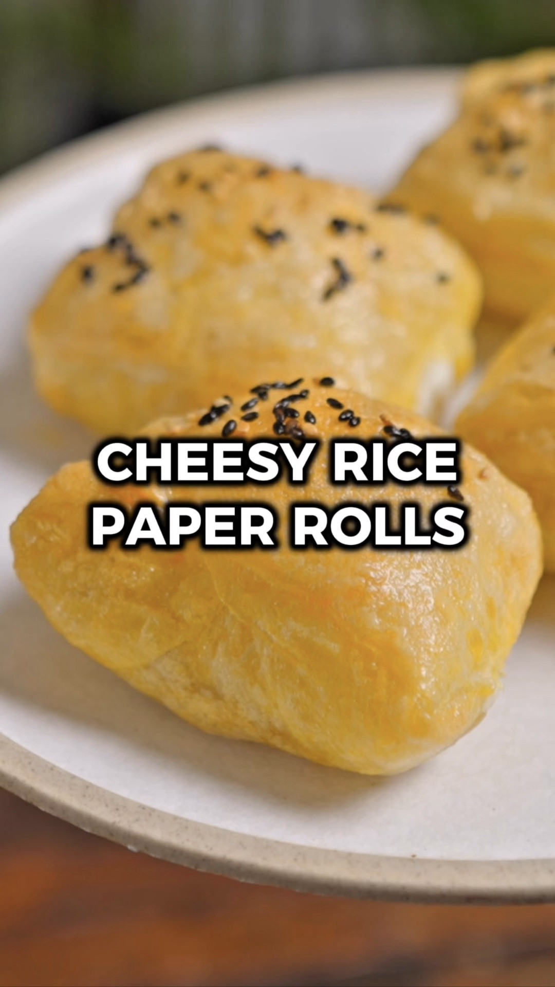 I've been on a rice paper kick lately and these crispy cheesy rolls might be my favorite thing I've made so far 🧀 The outside gets super crispy, the inner layers stay a little chewy, and the mozzarella inside gets all gooey and melted. It's a texture thing and I am absolutely here for it.

The best part? These are so easy to throw together and the combos are basically endless. I've been dipping mine in sweet chili sauce but I'm already plotting a honey ham and cheese version and I feel like that's going to be insane.

Would you try it? Let me know in the comments what you think if you do! 🙌

INGREDIENTS
8 sheets rice paper
3 eggs (beaten)
4 sticks string cheese (halved)
vegetable oil
1 tsp black sesame seeds
1 tsp white sesame seeds

INSTRUCTIONS
1️⃣ Beat the eggs in a wide, shallow bowl and cut your string cheese sticks in half.
2️⃣ Dip one sheet of rice paper into the egg until fully coated, then lay it flat on a cutting board. Place two string cheese halves side by side in the center, and once the rice paper is pliable, fold in the sides to enclose the cheese. Dip a second sheet of rice paper in the egg and wrap it around the outside as a second layer. Repeat to make all 4 rolls.
3️⃣ Brush each roll lightly with vegetable oil and place them in the air fryer. Sprinkle the sesame seeds over the top and cook for 8-10 minutes at 350°F, until crispy and golden.
4️⃣ Serve with sweet chili sauce for dipping, or experiment with your favorite dipping sauce.
5️⃣ Enjoy!

#LTKfoodie #LTKHome