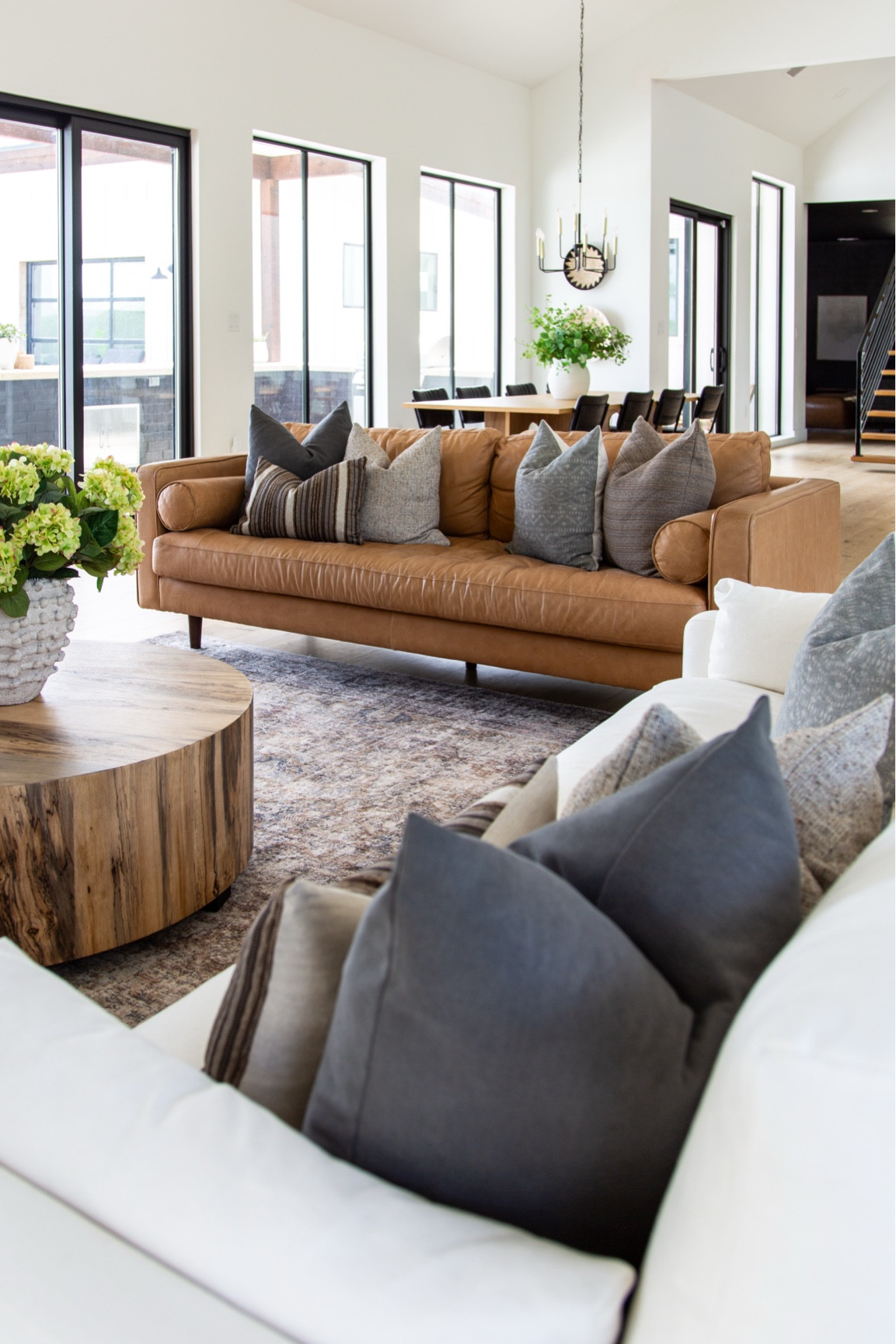 Welcome to my living room—a space that truly reflects my love for blending modern design with warm, natural elements. This leather sofa is one of my favorite pieces, both stylish and family-friendly, paired with cozy throw pillows that add layers of texture. The natural wood coffee table brings just the right amount of warmth and ties the space together perfectly. One thing I always prioritize is natural light, and the large windows make this room feel open and inviting all day long. Designing a home that’s both beautiful and functional is so important to me, and this space feels like the perfect balance.


#LTKHome #LTKFindsUnder100 #LTKSaleAlert