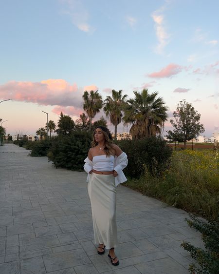 Pastel skies… but don’t be fooled it’s definitely colder than it looks ☁️ 
.
Shop this look via LTK in my bio, stories and april highlight 
.
.
.
Holiday outfit | sunset vibes | sunset pictures | summer holiday | evening outfit | satin skirt | pastel skies | pastel sunset | aesthetic vibes | outfit post | fashion influencer | timeless style | simple outfits | capsule fashion | basic outfit | pinterest fashion | all white outfit | cream outfit | neutral style

#LTKtravel #LTKeurope #LTKunder100