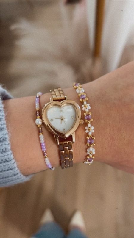 I have the cutest gold watch ever in the shape of a heart. This would make the perfect gift 💗 It’s also a perfect dupe for the Olivia Burton watch that’s over $150 while this one is $35! 🤩  I also paired it with my handmade 14k plated, flower beaded bracelet with violet crystals. 😍 Comment WATCH for the direct link or click the link in my bio ✨

#LTKGiftGuide #LTKVideo #LTKfindsunder50