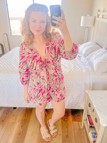 Cutest floral romper! 🌸 Perfect for curvy gals headed to the beach for Spring/Summer. 

50% off right now - under $50. 

Emma is wearing a size L - this one piece tie-front romper does fit TTS. It’s so comfortable and adorable. ✨ She paired with her affordable everyday faux birks! 

Vacation outfit, romper, curvy outfit, midsize 

#LTKmidsize #LTKsalealert #LTKstyletip