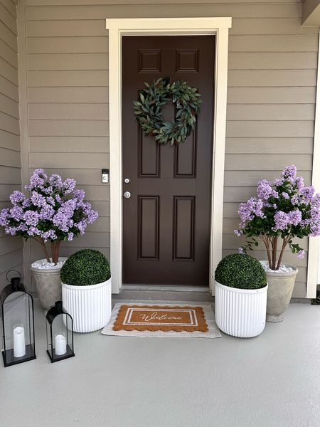 My purple lilac tree is back in stock in the smaller size (2 ft) I have the 4 foot shown here. Spring porch, faux florals, outdoor 

#LTKHome #LTKSaleAlert